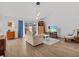 Bright living room with hardwood floors and large windows at 1581 Amberlea S Dr, Dunedin, FL 34698