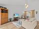 Bright living room with hardwood floors and large windows at 1581 Amberlea S Dr, Dunedin, FL 34698