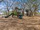 playground with slides, climbing structures, and wood-chip surface at 1581 Amberlea S Dr, Dunedin, FL 34698