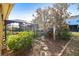 Landscaped backyard with hammock and pathway at 15811 Oakleaf Run Dr, Lithia, FL 33547
