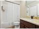 Clean bathroom with a single sink, granite countertop, and shower/tub combo at 15811 Oakleaf Run Dr, Lithia, FL 33547