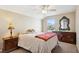 Bedroom with a double bed, nightstand, and dresser at 15811 Oakleaf Run Dr, Lithia, FL 33547