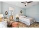 Spacious bedroom with a sitting area and ensuite bathroom access at 15811 Oakleaf Run Dr, Lithia, FL 33547