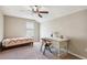Bedroom with twin bed, desk and chair, and ceiling fan at 15811 Oakleaf Run Dr, Lithia, FL 33547