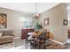Dining room with antique furniture and a chandelier at 15811 Oakleaf Run Dr, Lithia, FL 33547