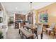 Bright dining area with wood table and bench seating at 15811 Oakleaf Run Dr, Lithia, FL 33547