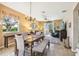 Dining room with table and chairs, open to living room at 15811 Oakleaf Run Dr, Lithia, FL 33547