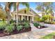 Craftsman style home with landscaped front yard, stone accents, and a welcoming porch at 15811 Oakleaf Run Dr, Lithia, FL 33547