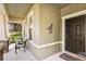 House exterior featuring a dark brown front door with a metal horse decoration at 15811 Oakleaf Run Dr, Lithia, FL 33547