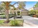 Front view of charming house with landscaped yard at 15811 Oakleaf Run Dr, Lithia, FL 33547