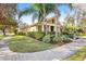House exterior with manicured lawn and palm trees at 15811 Oakleaf Run Dr, Lithia, FL 33547