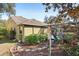 Side view of house with landscaping and hammock area at 15811 Oakleaf Run Dr, Lithia, FL 33547