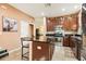 Modern kitchen with granite island and stainless steel appliances at 15811 Oakleaf Run Dr, Lithia, FL 33547