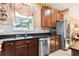 Kitchen features stainless steel appliances and ample cabinet space at 15811 Oakleaf Run Dr, Lithia, FL 33547