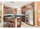 Open kitchen with stainless steel appliances and granite countertops at 15811 Oakleaf Run Dr, Lithia, FL 33547