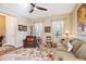 Living room featuring a neutral color palette, hardwood floors, and ample natural light at 15811 Oakleaf Run Dr, Lithia, FL 33547