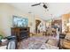 Open living room with a view into the dining area and kitchen, showcasing an inviting space at 15811 Oakleaf Run Dr, Lithia, FL 33547