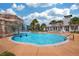 Relaxing community pool with waterfall feature at 15811 Oakleaf Run Dr, Lithia, FL 33547