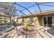 Covered patio with seating area, water feature, and access to the house at 15811 Oakleaf Run Dr, Lithia, FL 33547