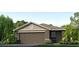 One-story home with brown siding, two-car garage, and landscaping at 17275 Whiskey Creek Trl, Parrish, FL 34219