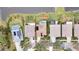 Aerial view of houses with pools and solar panels by a lake at 19820 Morden Blush Dr, Lutz, FL 33558