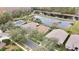 Aerial view of homes and a pond at 19820 Morden Blush Dr, Lutz, FL 33558