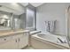 Bathroom with soaking tub, shower, and double vanity at 19820 Morden Blush Dr, Lutz, FL 33558