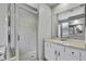 Bathroom with shower, vanity, and large mirror at 19820 Morden Blush Dr, Lutz, FL 33558