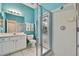 Bathroom boasts a shower, toilet, and vanity with a pool view at 19820 Morden Blush Dr, Lutz, FL 33558