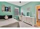 Bright bedroom with double bed, dresser, and window coverings at 19820 Morden Blush Dr, Lutz, FL 33558