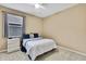 Spacious bedroom with a double bed and nightstand at 19820 Morden Blush Dr, Lutz, FL 33558