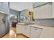 Modern kitchen with stainless steel appliances and white cabinets at 19820 Morden Blush Dr, Lutz, FL 33558