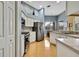 Modern kitchen with stainless steel appliances and white cabinets at 19820 Morden Blush Dr, Lutz, FL 33558