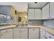 Modern kitchen with stainless steel appliances and white cabinets at 19820 Morden Blush Dr, Lutz, FL 33558