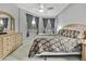 Spacious main bedroom with large windows and dresser at 19820 Morden Blush Dr, Lutz, FL 33558