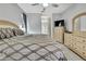 Main bedroom with ensuite bathroom access and large bed at 19820 Morden Blush Dr, Lutz, FL 33558
