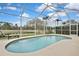 Inviting screened pool and patio area with pond view at 19820 Morden Blush Dr, Lutz, FL 33558