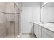 Modern bathroom with a walk-in shower and double vanity at 2146 Laceflower Dr, Brandon, FL 33510