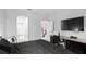 Bright bedroom with a king-size bed, en-suite bathroom access, and a home office at 2146 Laceflower Dr, Brandon, FL 33510