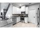 Well-equipped kitchen featuring white cabinets and granite countertops at 2146 Laceflower Dr, Brandon, FL 33510