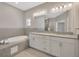 Double vanity bathroom with granite countertop and soaking tub at 2402 Cumberland Cliff Dr, Ruskin, FL 33570