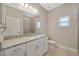 Bathroom features granite countertop and tiled shower at 2402 Cumberland Cliff Dr, Ruskin, FL 33570