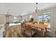 Dining area with wood table and chairs, open to living room at 2402 Cumberland Cliff Dr, Ruskin, FL 33570