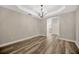 Bright dining room features elegant chandelier and hardwood floors at 2402 Cumberland Cliff Dr, Ruskin, FL 33570