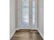 Bright entryway with white door and wood-look flooring at 2402 Cumberland Cliff Dr, Ruskin, FL 33570