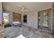 Relaxing front porch features a white swing and ceiling fan at 2402 Cumberland Cliff Dr, Ruskin, FL 33570