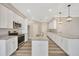 Modern kitchen with white cabinets and granite counters at 2402 Cumberland Cliff Dr, Ruskin, FL 33570
