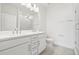 Bright bathroom boasts double sinks, a walk-in shower, and modern vanity at 2506 W Cleveland St # 18, Tampa, FL 33609