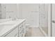 Modern bathroom with double vanity, quartz countertop, and glass shower at 2506 W Cleveland St # 18, Tampa, FL 33609