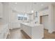 Modern white kitchen with stainless steel appliances and quartz countertops at 2506 W Cleveland St # 18, Tampa, FL 33609